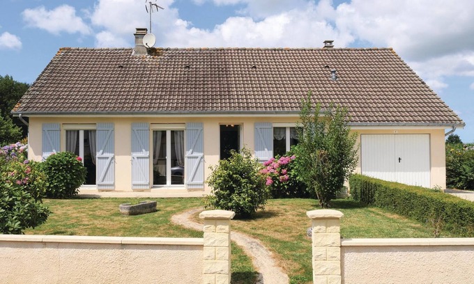 Chef-du-Pont House | This large house is tastefully decorated and has a large living room with an open fireplace.