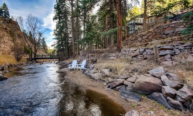 Evergreen House | Timeless 100 Year Old Creekside Cabin near Red Rocks. King size bed.