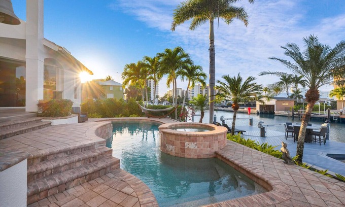 Vanderbilt Beach House | Tropical Oasis! - Luxury Canal Home! 1 Mile To The Beach! Heated Pool & Spa