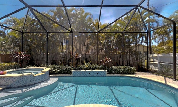 Naples Park House | Two Master Bedrooms! Less than 1 Mile to the beach with heated pool and spa