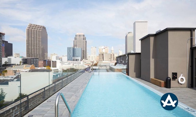 Central Business District Hotel | Sextant The Brandywine Rooftop Pool 5 min drive to Bourbon St 4 Bed 4 Bath