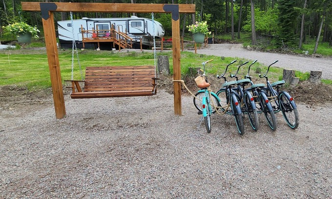 Lakeside House | Vacation Camper with private area behind with Seating, Firepit, and Hot tub