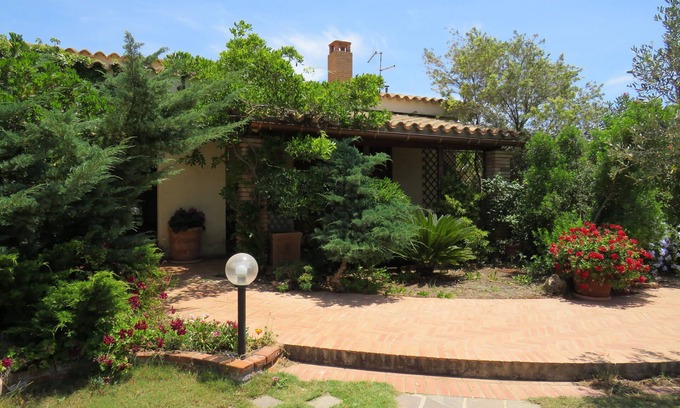 Teulada House | Villa near the sea submerged in greenery