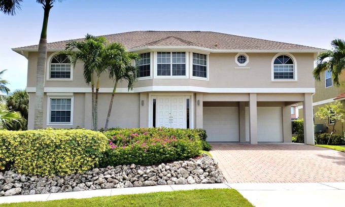 Marco Island House | Walk to Beach, Restaurants, Shops, Movies. Water Front, Large Heated Pool, Dock