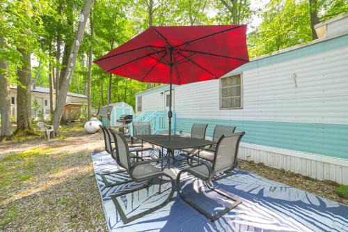Kalkaska House | Walk to Manistee Lake Retro Cottage with Fire Pit!