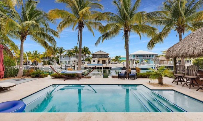Venetian Shores House | Waterfront Getaway in Venetian Shores – Pool, Hot Tub, Tiki Hut & More