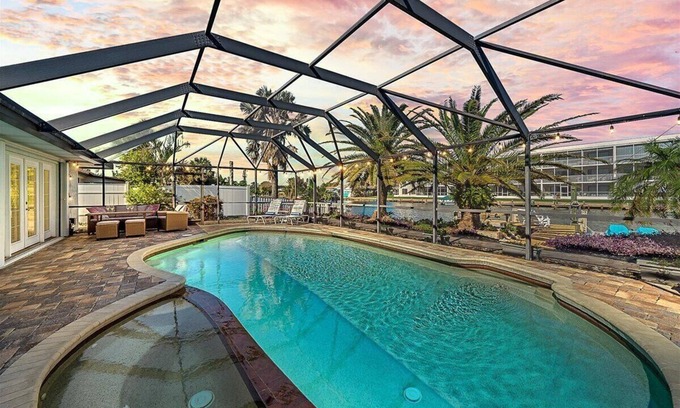 Cocoa Isles House | Waterfront-Heated Pool-Hottub-4bd-2BA-Paddle boat- Kayaks