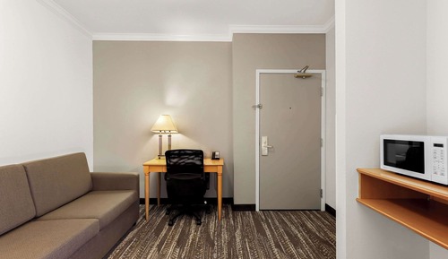 Suite, 2 Queen Beds with Sofa Bed, Refrigerator & Microwave