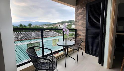 One-Bedroom Apartment with Balcony and City View