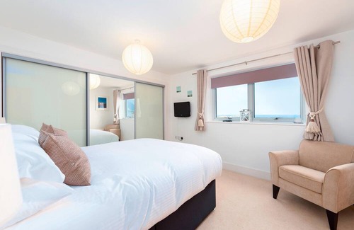 Lusty Glaze Apartment | 2 Bolowthas Court-Spacious apartment close to beaches, parking, coastal and sea views.
