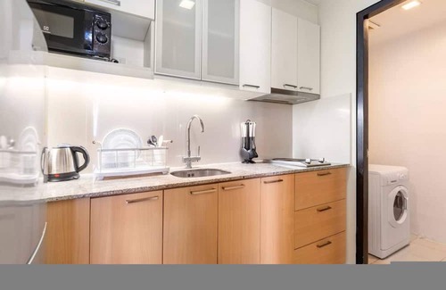 Lapu-Lapu Apartment | Two Furnished 1BRs | Amenity View, WiFi, Netflix, Pool and Beach