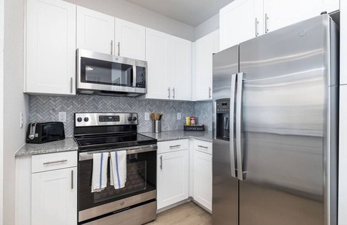 Lewisville Apartment | Elegant 2BD: Pool, Fitness & Organized Workspace