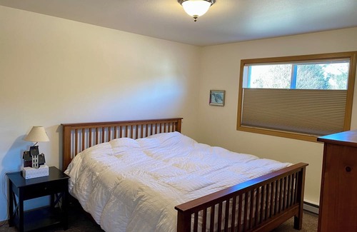 Juneau Apartment | Sunny apartment near a lake, great walking trails, and a playground on site.