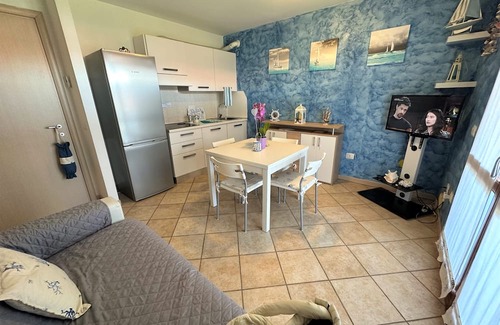 Aprilia Marittima Apartment | Flat in a colourful residence with pool