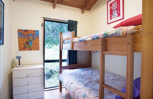 Tawharanui House | A slice of paradise. Kiwi Bach settled in native bush & just 2 mins the beach