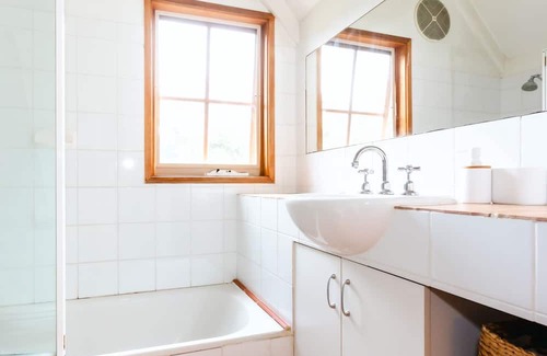 Cape Schanck House | Rosemary Cottage - you'll be greeted by a sprawling lawn and a canopy of mature trees.