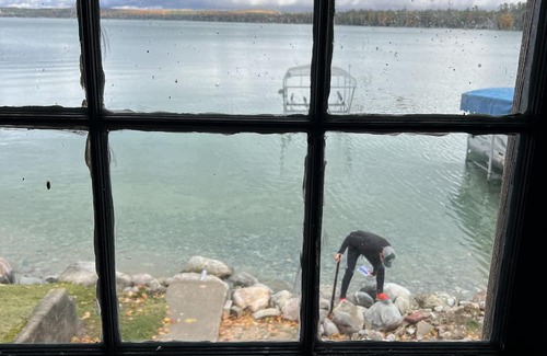 Rapid City House | 50 feet of Torch Lake frontage! Boathouse, beautiful patios sweet little beach.