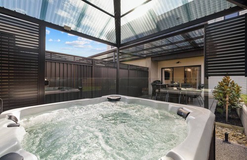 San Remo House | San Remo Luxe 1, large modern home with 180-degree bay views, outdoor spa.