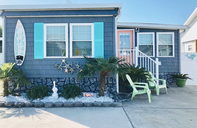 One minute drive to beach with golfcart! Newly updated, beach decor and clean!