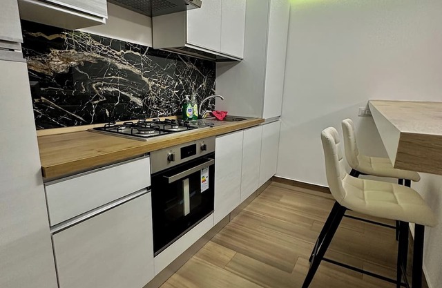TRENDY HOME apartment 5 minutes from the sea , and from the train station .